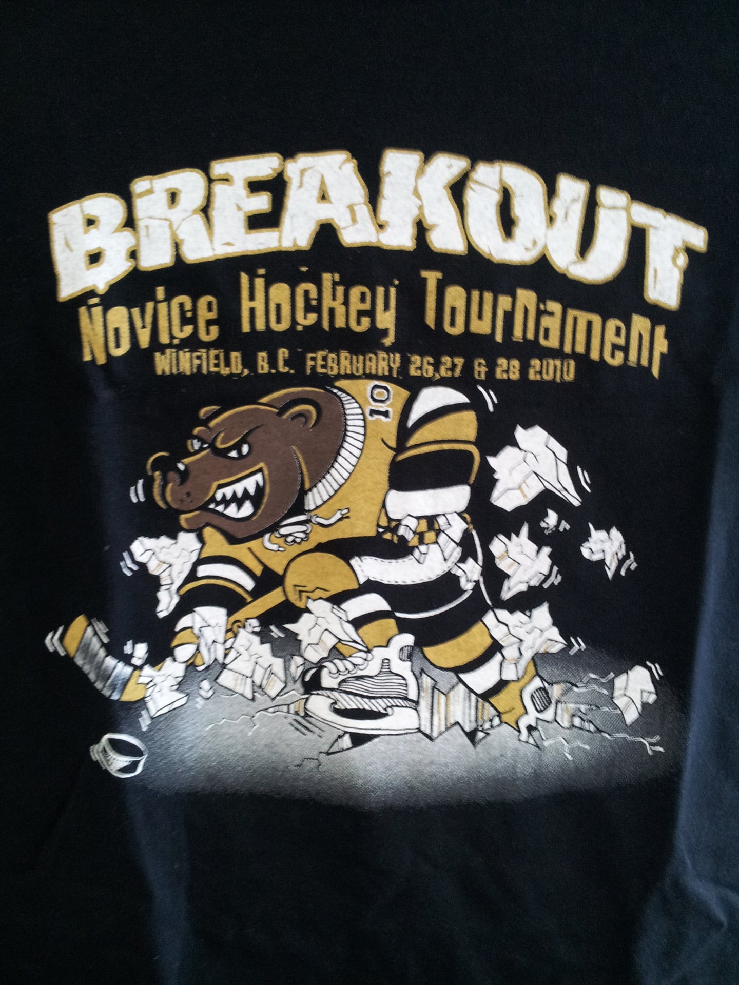 Black t-shirt featuring the text "Breakout Hockey Tournament" prominently displayed on the front.