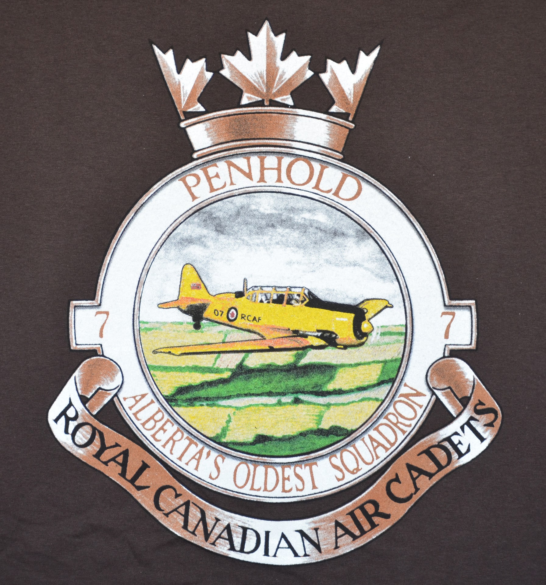 Brown t-shirt featuring the word "Penhold" printed prominently on the front.