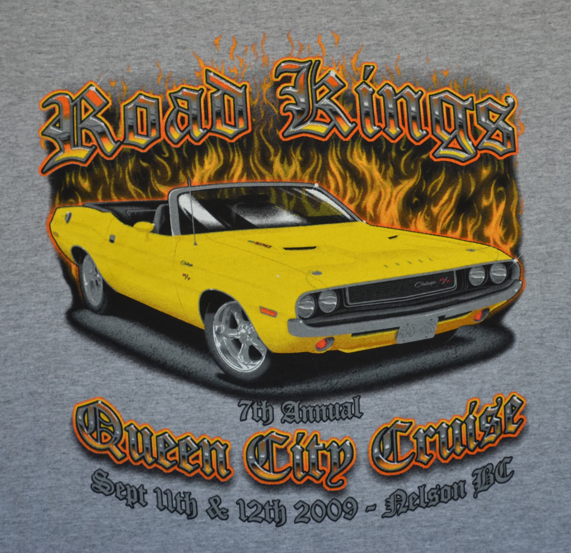 Yellow muscle car graphic on a t-shirt labeled "Road Kings Queen City Cruise Shirt."