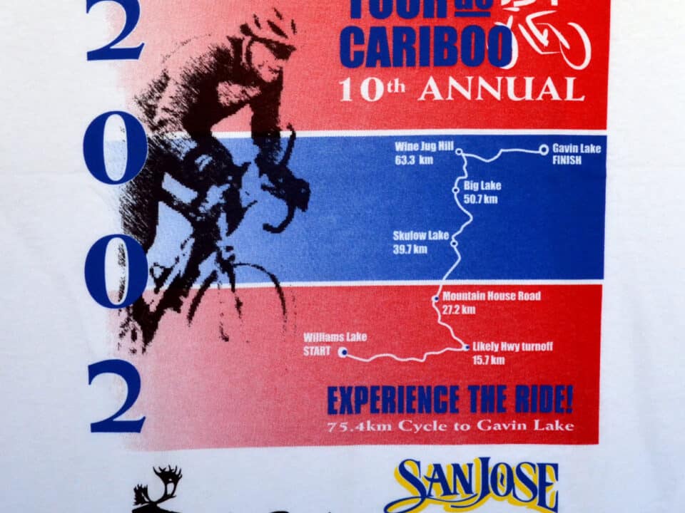 Tour De Cariboo 2002 shirt featuring a colorful design with cycling graphics and event details prominently displayed.